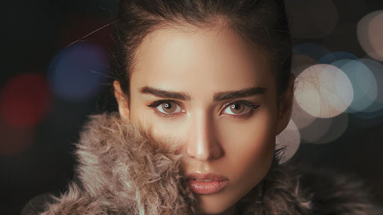 Elegant woman with flawless skin and striking eyes – luxury beauty concept at Aphrodite Clinic